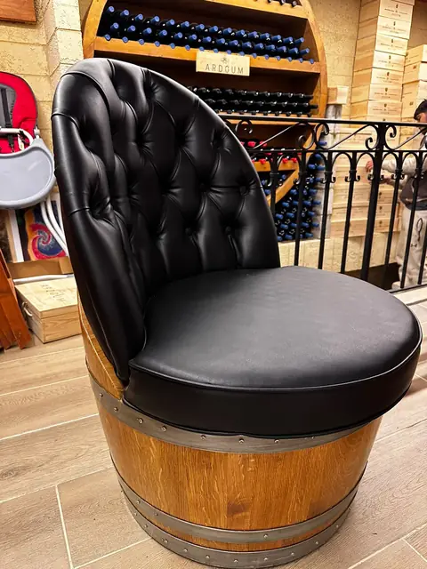 A barrel armchair photographed in the workshop.