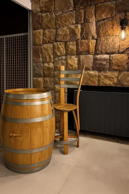 An indoor pairing of a barrel table with a matching barrel chair.